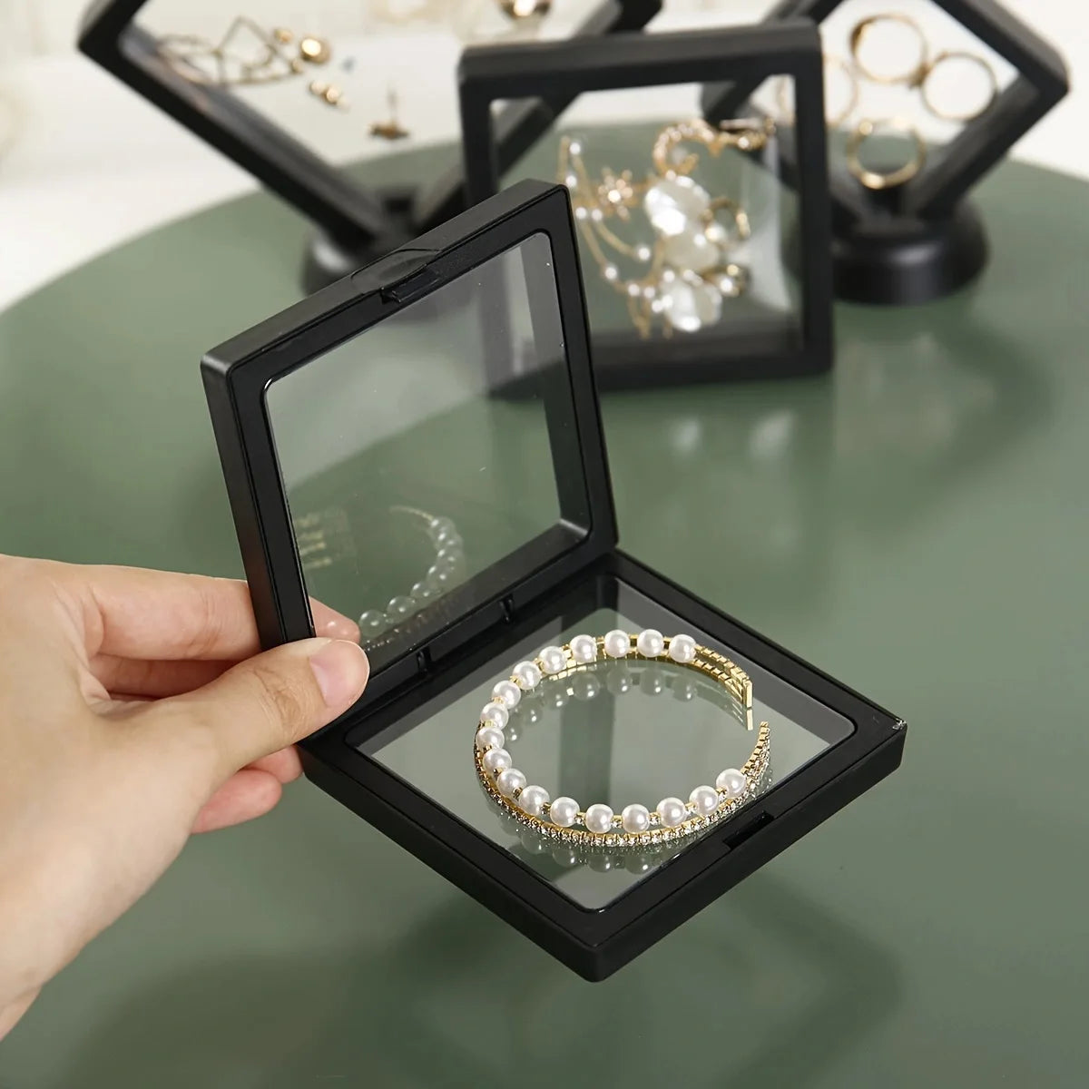 Transparent floating display box, plastic film jewelry packaging box, jewelry, necklace, ring, and collectible storage box